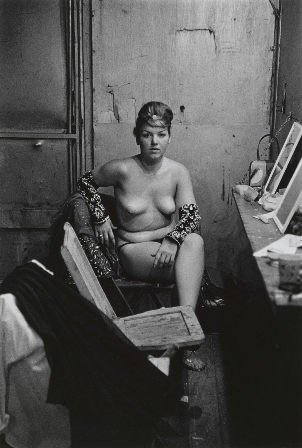 11.-Stripper-with-bare-breasts-sitting-in-her-dressing-room-Atlantic-City-N.J.-1961